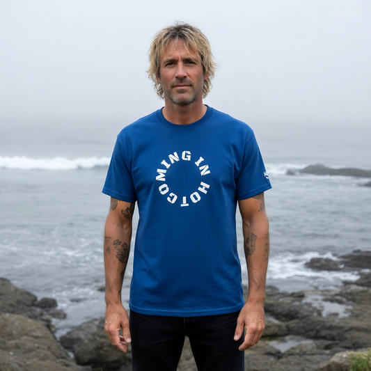9BARN Coming In Hot classic tee in royal blue, worn on the Santa Cruz coast.